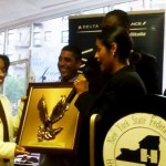 City Council Member Diana ReyNa presenting Dominican Business Woman Award to Maritza Polanco, President of the Micro Chamber of Commerce