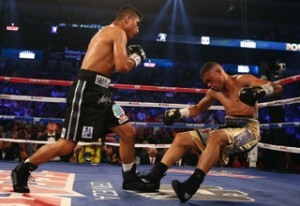 Mikey Garcia (l.) made short work of Juan Manuel Lopez (r.) in their featherweight bout Saturday.