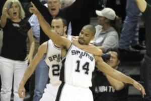 Manu Ginobili (l.) embraces teammate Garry Neal (r.) after Neal hit one of San Antonio's 16 3-pointers vs. Miami in Game 3.