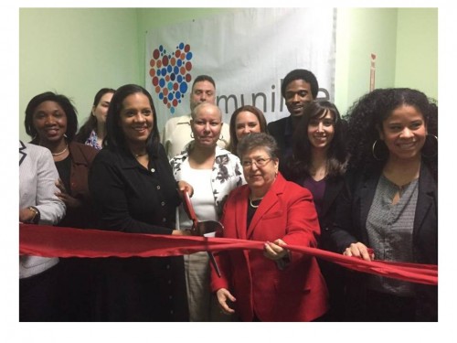 Life is Precious founder, Dr. Rosa María Gil, (c., in red) Councilmember Julissa Ferreras (l., with scissors) and staff, parents and students at ribbon-cutting ceremonies at the suicide prevention program's new Queens facility in Long Island City.